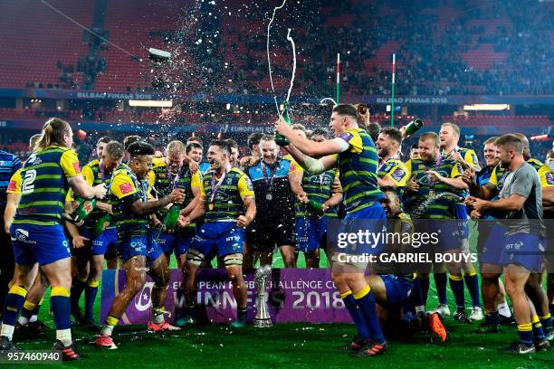 Cardiff Blues players celebrate with champagne after winning the 2018 European Challenge Cup final rugby union match against Gloucester at the San...