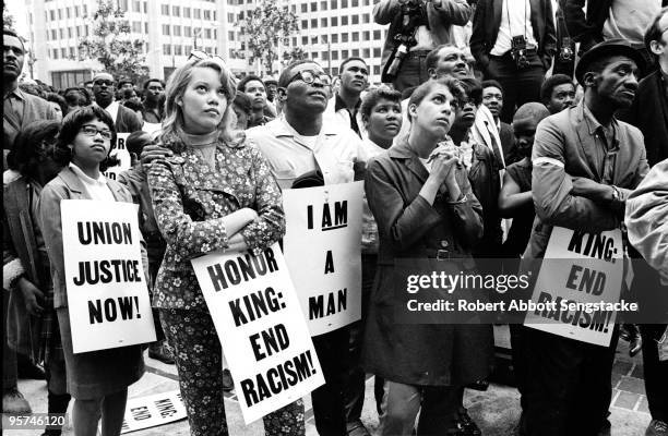 Group of demonstrators holding signs reading 'Union Justice Now', 'Honor King: End Racism!' and 'I Am A Man' march in protest soon after the...