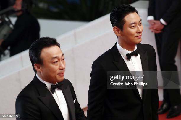 Actor Sung-min Lee and actor Ji-Hoon Ju attend the screening of "The Spy Gone North " during the 71st annual Cannes Film Festival at Palais des...