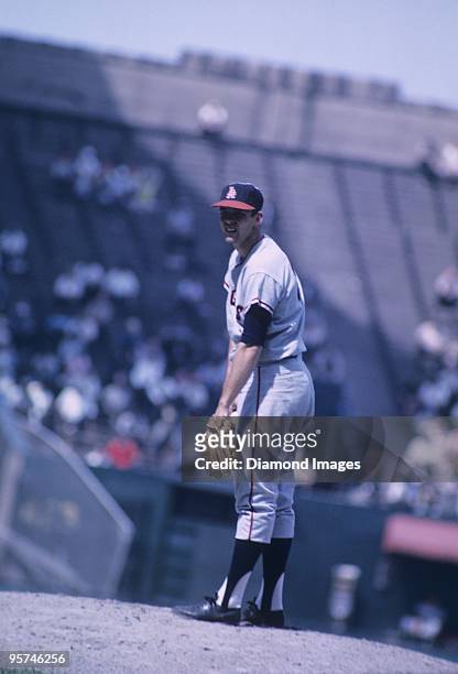 Pitcher Dean Chance of the Los Angeles Angels gets the sign for the next pitch during the second game of a doubleheader on June 20, 1965 against the...