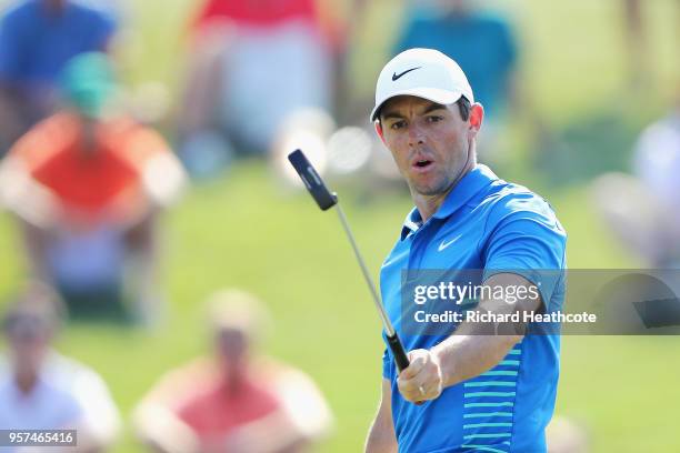 Rory McIlroy of Northern Ireland reacts to his putt for eagle on the 12th green during the second round of THE PLAYERS Championship on the Stadium...