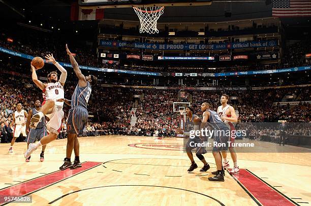 Marco Belinelli of the Toronto Raptors puts up a shot against Ronald Murray of the Charlotte Bobcats during the game on December 30, 2009 at Air...