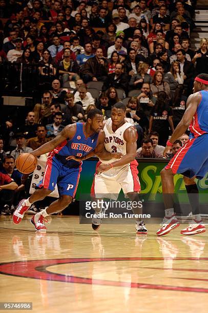 Rodney Stuckey of the Detroit Pistons drives the ball against Marcus Banks of the Toronto Raptors during the game on December 27, 2009 at Air Canada...