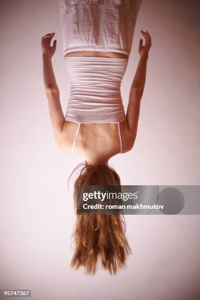 woman hanging upside down - hang upside down for back stock pictures, royalty-free photos & images