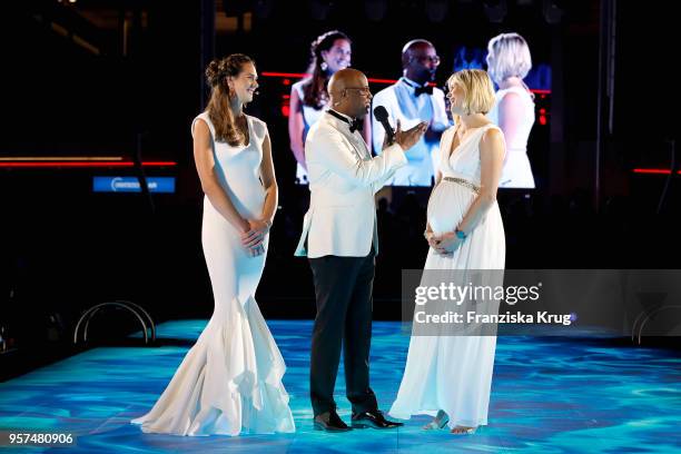 Godmother Kira Walkenhorst wearing a dress by Lever Couture, Yared Dibaba and godmother Laura Ludwig during the naming ceremony of the cruise ship...