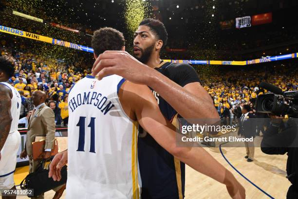 Klay Thomspon of the Golden State Warriors hugs Anthony Davis of the New Orleans Pelicans after Game Five of the Western Conference Semifinals of the...