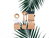 Modern blogger concept. Workspace with eco Kraft items on white background. Flat lay