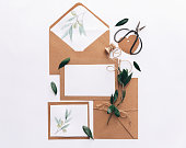 Flat lay Workspace Mock Up Wedding invitation cards, craft envelopes.  top view. Templates.