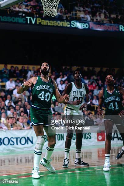 James Donaldson of the Dallas Mavericks boxes out against Robert Parish of the Boston Celtics during a game played in 1987 at the Boston Garden in...