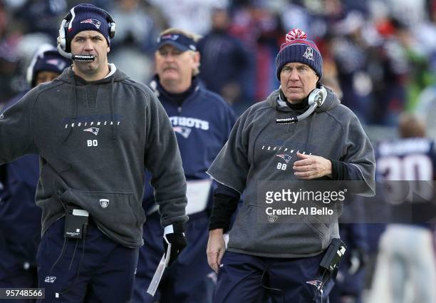 Head coach Bill Belichick and quarterbacks coach Bill O'Brien of the New England Patriots look on against the Baltimore Ravens during the 2010 AFC...