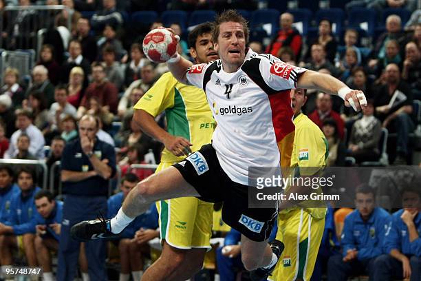 Oliver Roggisch of Germany tries to score a goal during the international handball match between Germany and Brazil at the SAP Arena on January 13,...