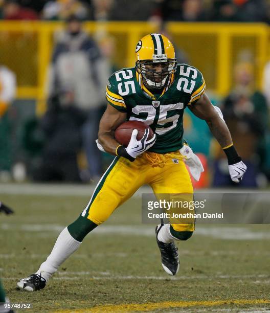 Ryan Grant of the Green Bay Packers runs against the Baltimore Ravens at Lambeau Field on December 7, 2009 in Green Bay, Wisconsin. The Packers...