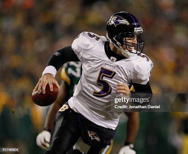 Joe Flacco of the Baltimore Ravens rolls out to look for a receiver against the Green Bay Packers at Lambeau Field on December 7, 2009 in Green Bay,...