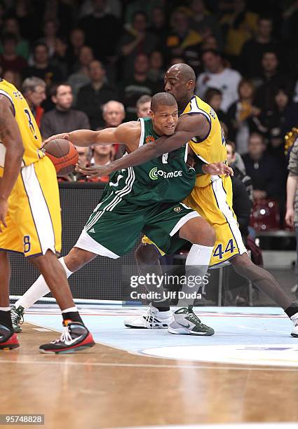 Mike Batiste, #8 of Panathinaikos competes with Ruben Boumtje, #44 of EWE Basket Oldenburg during the Euroleague Basketball Regular Season 2009-2010...