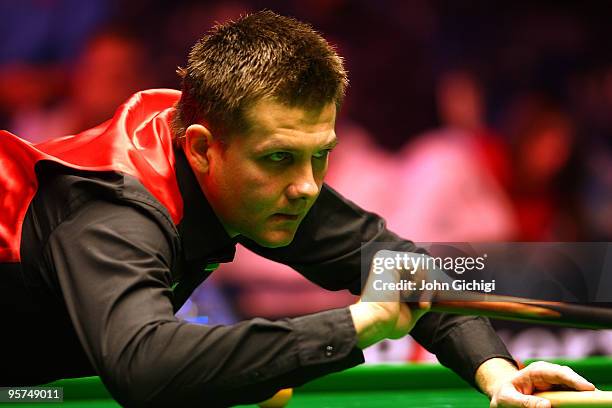 Ryan Day of Wales takes a shot in his second round match against Joe Perry of England during the PokerStars Masters snooker tournament at Wembley...