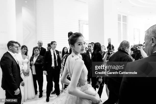 Guan Xiaotong departs the Martinez Hotel ahead of the 'Ash Is The Purest White ' during the 71st annual Cannes Film Festival at on May 11, 2018 in...