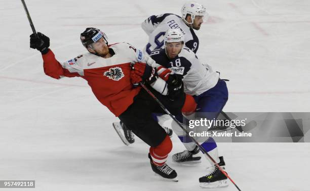 Yohann Auvitu of France stop Michael Raffl of Austria during the 2018 IIHF Ice Hockey World Championship Group A between Austria and France at Royal...