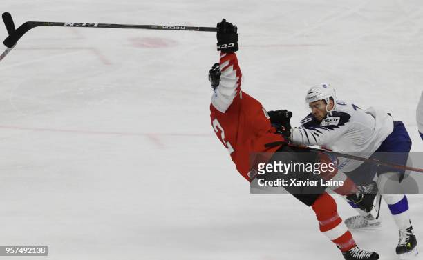 Yohann Auvitu of France stop Michael Raffl of Austria during the 2018 IIHF Ice Hockey World Championship Group A between Austria and France at Royal...