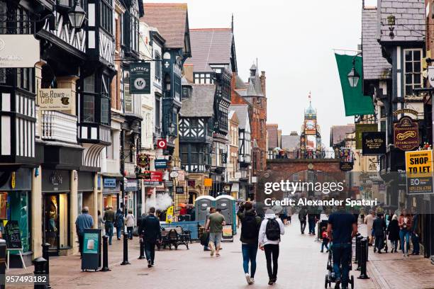pedestrian shopping street (bridge street) in chester, england, uk - chester england fotografías e imágenes de stock