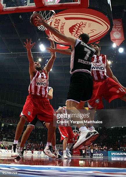 Ioannis Bourousis, #9 of Olympiacos Piraeus competes with Dusan Kecman, #7 of Partizan Belgrade during the Euroleague Basketball Regular Season...