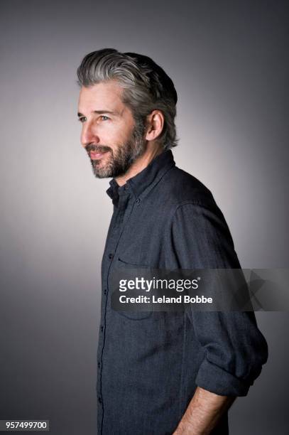 studio portrait of adult male with gray hair - seitenansicht stock-fotos und bilder