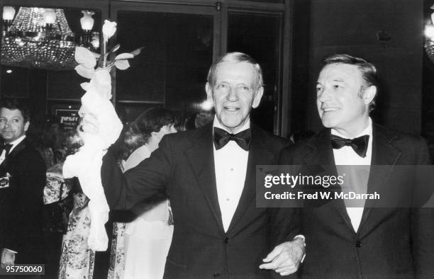 At the Ziegfeld Thearte, American actors and dancers Fred Astaire and Gene Kelly attend the premiere of the film 'That's Entertainment, Part II,'...