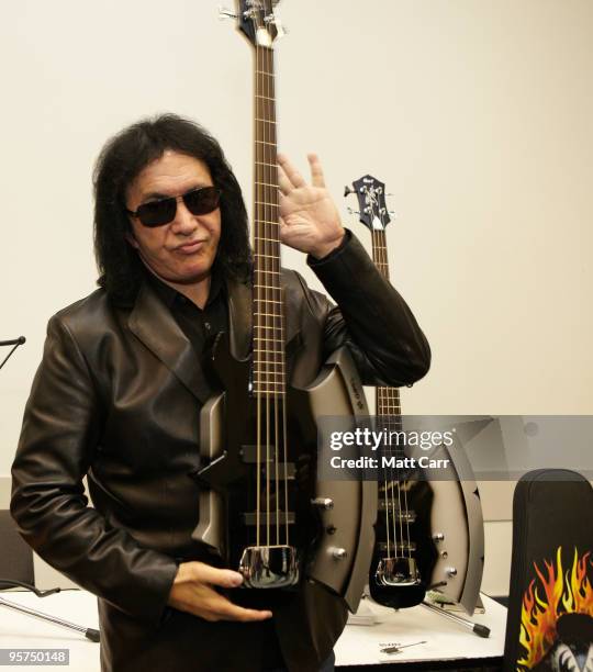 Gene Simmons of Kiss poses with the new Cort GS-Axe-2 bass at the 2010 NAMM show at Anaheim Convention Center on January 13, 2010 in Anaheim,...