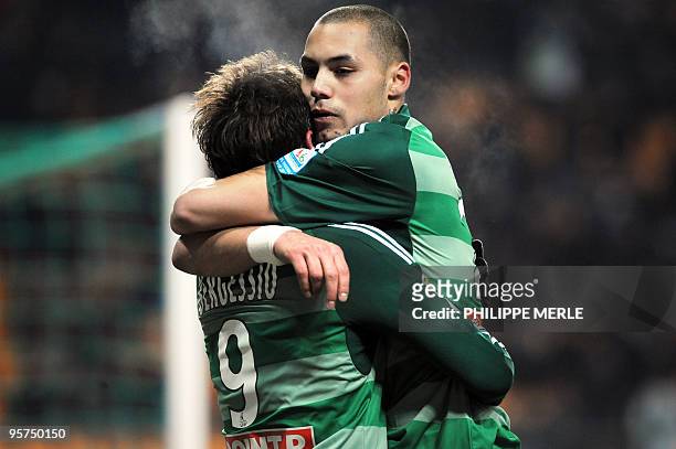 Saint-Etienne's Argentinian forward Gonzalo Ruben Bergessio is congratulated by his teammate Yohan Benalouane after scoring a goal during the French...