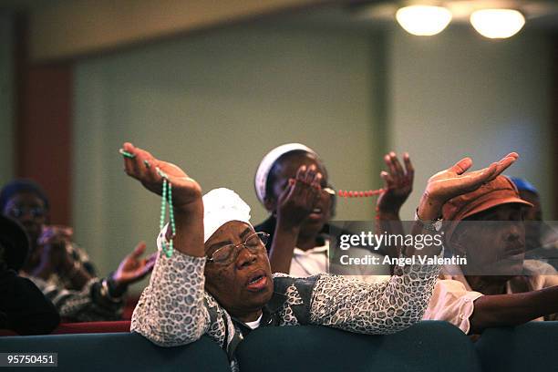 Small group of parishioners hold a prayer service for earthquake victims at the Notre Dame d'Haiti Catholic Church in the Little Haiti neighborhood...