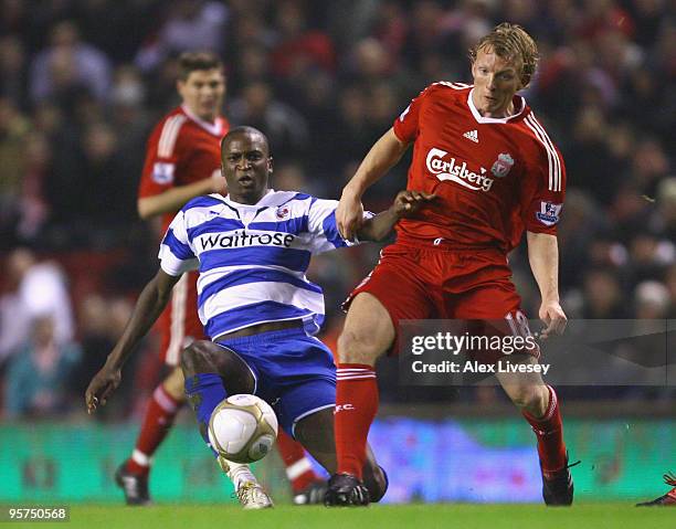 Kalifa Cisse of Reading battles for the ball with Dirk Kuyt of Liverpool during the FA Cup sponsored by E.ON 3rd Round Replay match between Liverpool...