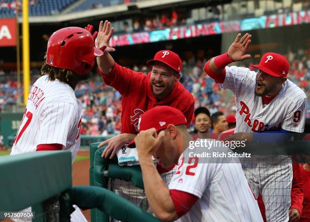 Odubel Herrera of the Philadelphia Phillies is congratulated by Andrew Knapp and Jesmuel Valentin after hitting a home run during the first inning of...