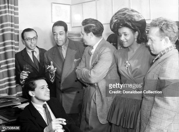 Portrait of Ahmet M. Ertegun, Nesuhi Ertegun, Duke Ellington, William P. Gottlieb, and Dave Stewart, William P. Gottlieb's home, Maryland, 1941.