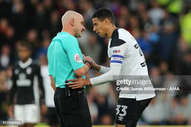 Curtis Davies of Derby County speaking to referee Roger East during the Sky Bet Championship Play Off Semi Final:First Leg match between Derby County...