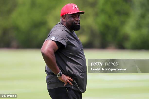 Defensive line coach Brentson Buckner watches the action during the Tampa Bay Buccaneers Rookie Minicamp on May 11, 2018 at One Buccaneer Place in...