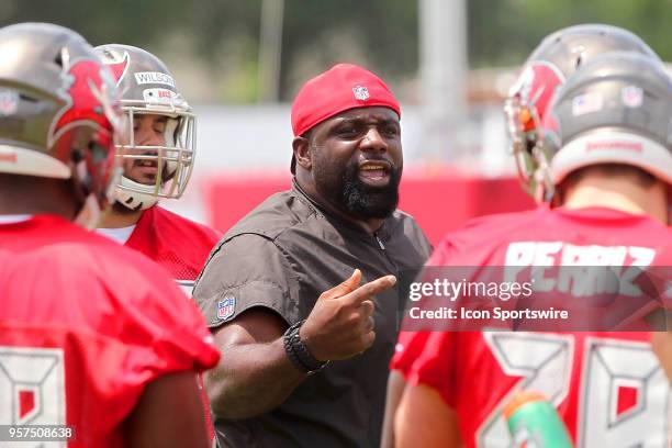 Defensive line coach Brentson Buckner talks to his players during the Tampa Bay Buccaneers Rookie Minicamp on May 11, 2018 at One Buccaneer Place in...