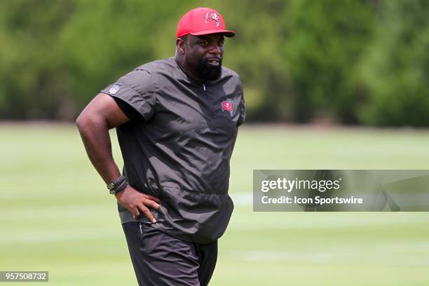 Defensive line coach Brentson Buckner watches the action during the Tampa Bay Buccaneers Rookie Minicamp on May 11, 2018 at One Buccaneer Place in...