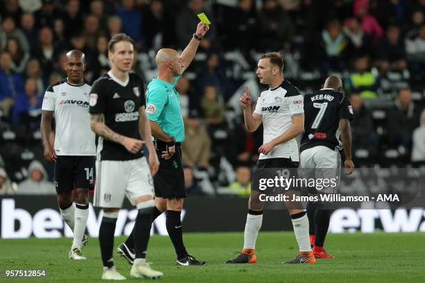 Andreas Weimann of Derby County is booked by match referee Roger East during the Sky Bet Championship Play Off Semi Final:First Leg match between...