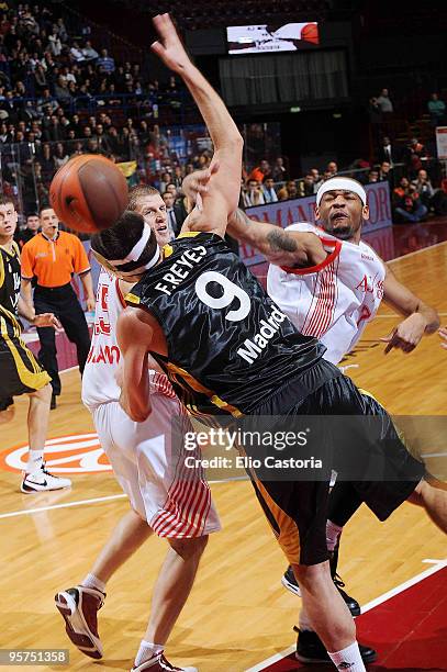 Michael Hall, #7 of Armani Jeans Milano passes the ball against Felipe Reyes, #9 of Real Madrid during the Euroleague Basketball Regular Season...