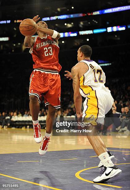 Jodie Meeks of the Milwaukee Bucks is fouled by Shannon Brown of the Los Angeles Lakers during the game at Staples Center on January 10, 2010 in Los...