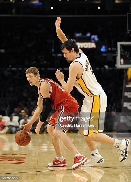 Luke Ridnour of the Milwaukee Bucks keeps his dribble away from Adam Morrison of the Los Angeles Lakers at Staples Center on January 10, 2010 in Los...