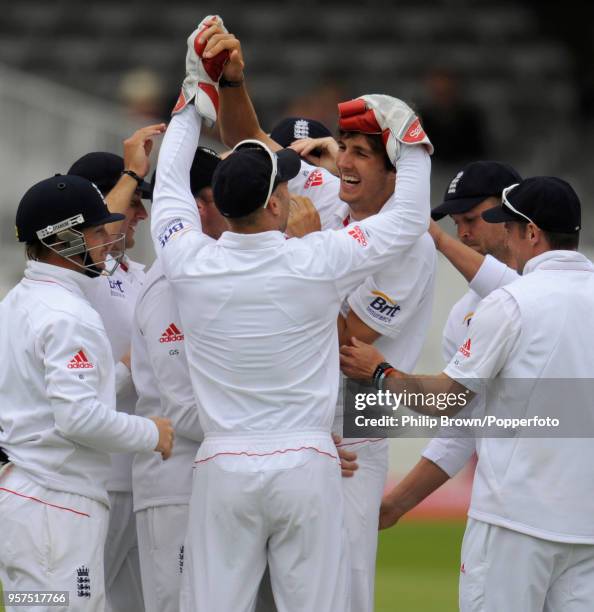 Steven Finn on his Test debut for England is congratulated by wicketkeeper Matt Prior and teammates after dismissing Bangladesh batsman Mushfiqur...