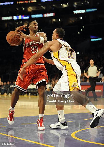 Jodie Meeks of the Milwaukee Bucks is fouled by Shannon Brown of the Los Angeles Lakers during the game at Staples Center on January 10, 2010 in Los...