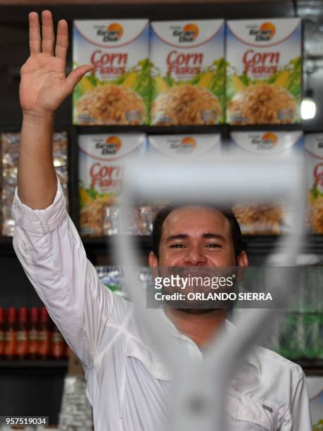 Honduran Jorge Carbajal who was mutilated when trying to illegally reach the US at the age of 17, is pictured at his grocery store, in Choluteca, 100...