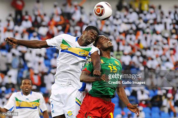 Georges Ambourouet of Gabon and Achille Webo of Cameroon compete for the ball during the Africa Cup of Nations match between Cameroon and Gabon at...