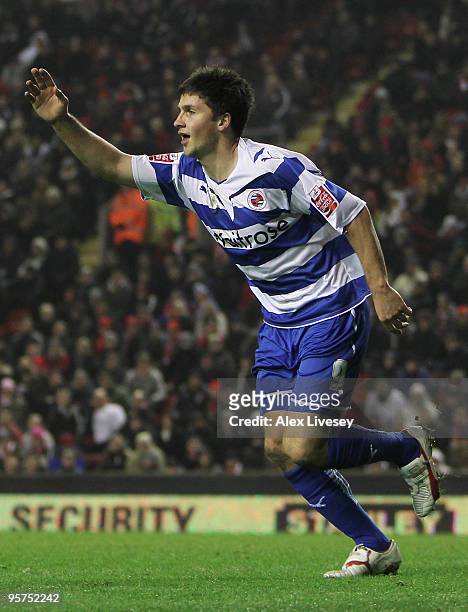 Shane Long of Reading celebrates scoring his team's second goal during the FA Cup sponsored by E.ON 3rd Round Replay match between Liverpool and...