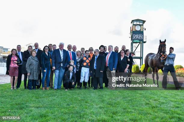 Connections of Rock Hard with Chris Caserta after winning the Ladbrokes Back Yourself Plate at Caulfield Racecourse on May 12, 2018 in Caulfield,...