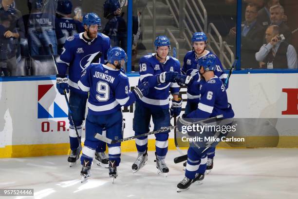 Ondrej Palat of the Tampa Bay Lightning celebrates with his teammates after scoring a goal against Braden Holtby of the Washington Capitals during...