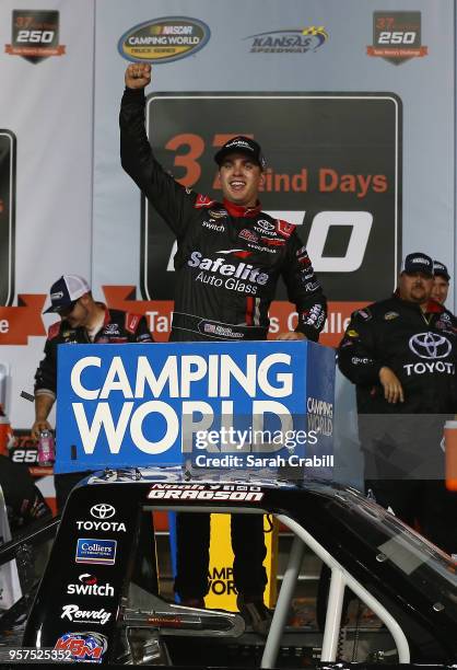 Noah Gragson, driver of the Safelite Toyota, celebrates in victory lane after winning the NASCAR Camping World Truck Series 37 Kind Days 250 at...