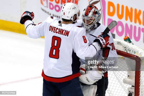 Alex Ovechkin of the Washington Capitals celebrates with his teammate Braden Holtby after defeating the Tampa Bay Lightning in Game One of the...