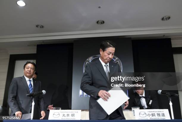 Akira Marumoto, incoming chief executive officer of Mazda Motor Corp., left, and Masamichi Kogai, outgoing president and chief executive officer,...